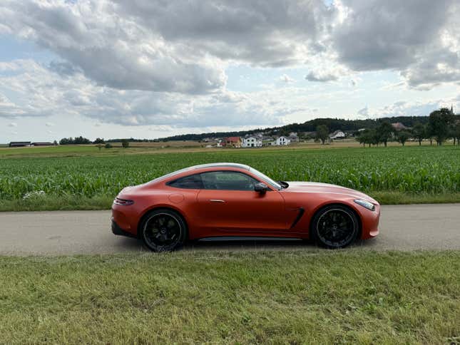 Side view of a matte orange 2025 Mercedes-AMG GT63 S E Performance