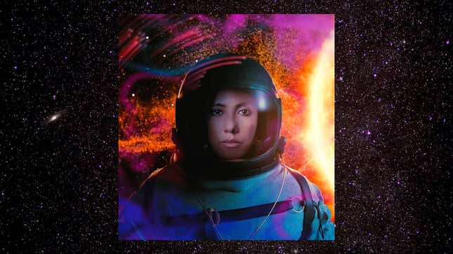 Stephanie Beatriz in a space suit in front of swirly whirly colorful patterns.