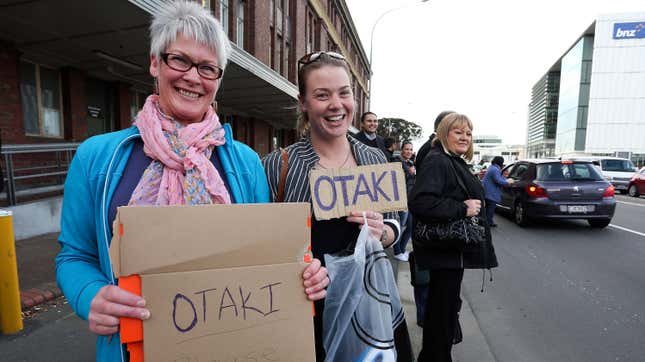 Jill Crooks of Arrowtown and daughter Maggie Crooks of Kapiti attempt to hitchhike home after all train service were cancelled following a magnitude 6.2 earthquake on August 16, 2013 in Wellington, New Zealand.