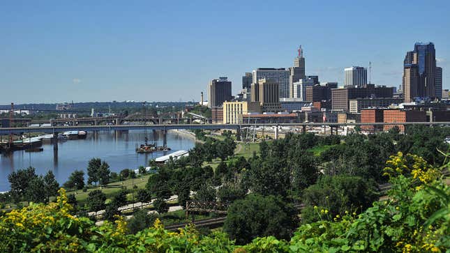 A photo of the Minneapolis skyline and river. 