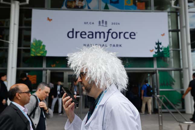 Salesforce technology advisor Larry Salomon on the phone dressed as Albert Einstein at the Dreamforce 2024 conference in San Francisco.