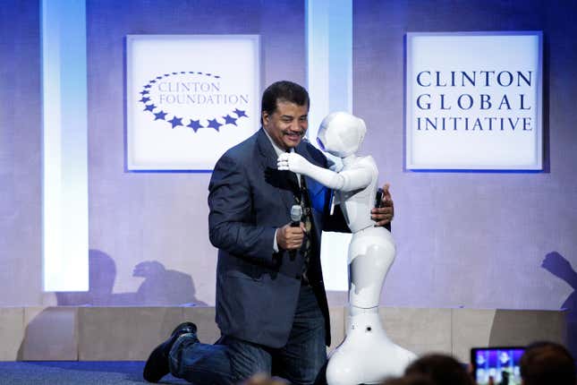 Neil deGrasse Tyson hugs Pepper at the Looking to the Next Frontier session during the 2015 Clinton Global Initiative’s Annual Meeting at the Sheraton New York Hotel &amp; Towers on September 28, 2015 in New York City.
