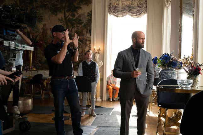 This image released by Amazon MGM Studios shows director David Ayer, left, and Jason Statham on the set of &quot;The Beekeeper.&quot; (Amazon MGM Studios via AP)