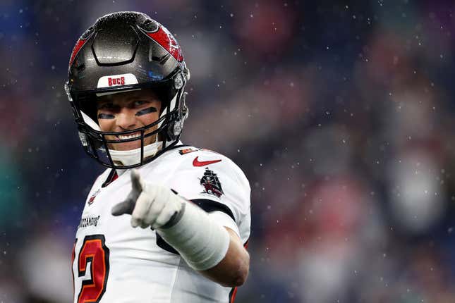 Tom Brady #12 of the Tampa Bay Buccaneers smiles during warmups before the game between the New England Patriots and the Tampa Bay Buccaneers at Gillette Stadium on October 03, 2021 in Foxborough, Massachusetts. 