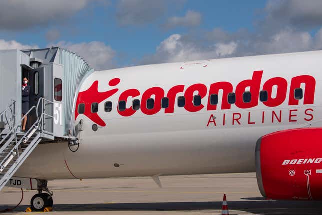 FILE - Senior cabin crew member Magdalini Michailidou stands on the gangway prior the first holiday flight of the Corendon Airlines Europe to the Greek destination Rhodos at the airport Erfurt-Weimar in Erfurt, Germany, July 2, 2020. Corendon Airlines says that it will sell an adults-only zone — no one under 16 allowed — on flights between Amsterdam and Curacao starting in November 2023. The Turkish carrier says people traveling without children will get quiet surroundings, and parents won&#39;t have to worry that their crying or fidgeting kids will annoy fellow passengers. (AP Photo/Jens Meyer, File)