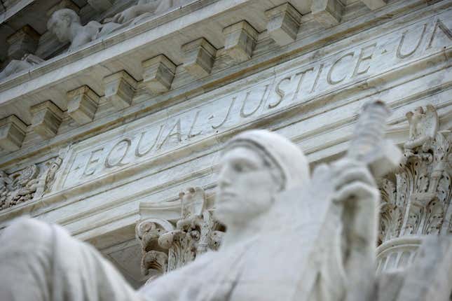 WASHINGTON, DC - JUNE 15: The statue Authority of Law by sculptor James Earle Fraser stands on the steps of the U.S. Supreme Court 