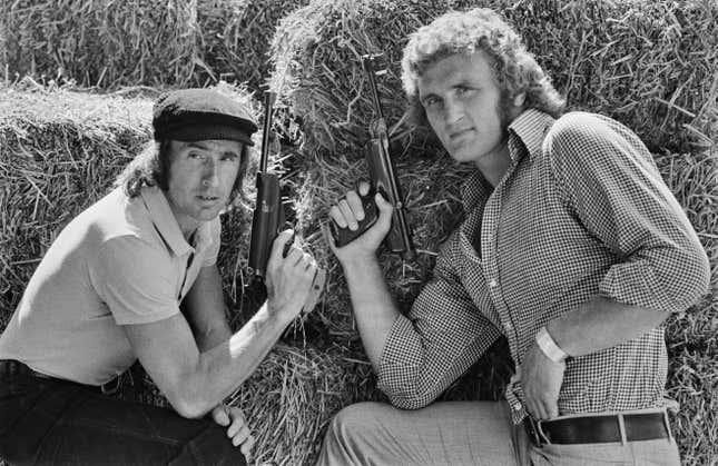 Jackie Stewart (left) and boxer Joe Bugner (right).