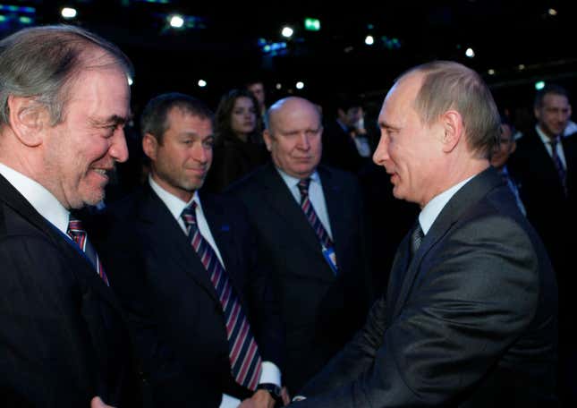 FILE - Then-Russian Prime Minister Vladimir Putin, right, congratulates members of the Russian delegation, from left: conductor Valery Gergiyev, businessman Roman Abramovich and Nizhny Novgorod Gov. Valery Shantsev; after it was announced that Russia would host the 2018 soccer World Cup in Zurich, Switzerland, Dec. 2, 2010. When Putin came to power in 2000, the outside world viewed Russia&#39;s &quot;oligarchs&quot; as men who whose vast wealth made them almost shadow rulers. Putin was reported to have told about two dozen of the men regarded as the top oligarchs in a meeting later in 2000 that if they stayed out of politics, their wealth wouldn&#39;t be touched. (AP Photo/Alexei Nikolsky, Pool, File)