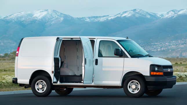 A photo of a white Chevrolet Express van. 