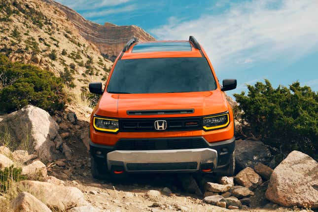 Front end of an orange 2026 Honda Passport TrailSport