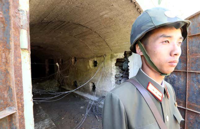 A North Korean soldier stands guard in front of the third tunnel of Punggye-ri nuclear test ground before it is blown up during the dismantlement process in Punggye-ri, North Hamgyong Province, North Korea May 24, 2018. Picture taken May 24, 2018