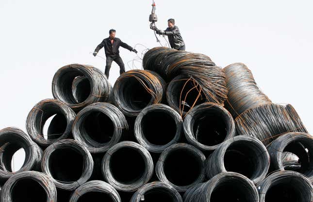 Workers over steel wire in China