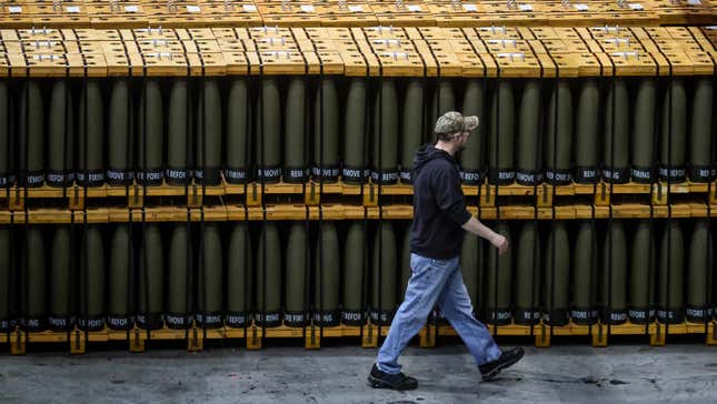 A worker walks past stacks of 155mm artillery shell packed for shipping at the Scranton Army Ammunition Plant in Scranton, Pennsylvania, U.S., February 16, 2023. 