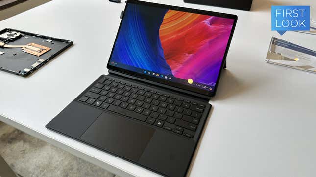 The Asus ProArt PZ13 laptop on a white table