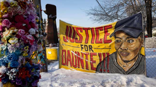 The memorial site for Daunte Wright sits covered in snow on Wednesday, Dec. 8, 2021, in Brooklyn Center, Minnesota as opening statements begin in the trial for former police officer Kim Potter.