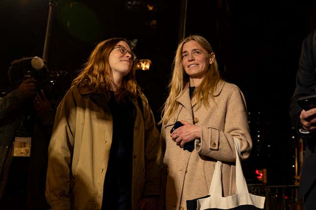 Graham Chase Robinson, center, and her attorney Alexandra Hardin, left, depart a federal courthouse in New York on Thursday, Nov. 9, 2023. (AP Photo/Peter K. Afriyie)