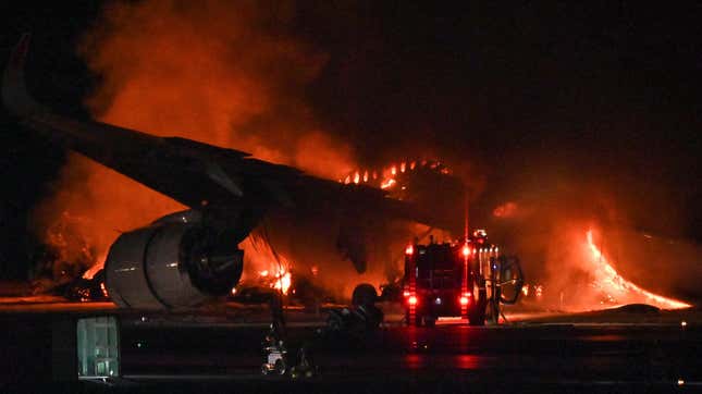 A Japan Airlines (JAL) passenger plane is seen on fire on the tarmac at Tokyo International Airport at Haneda on January 2, 2024.
