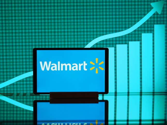 Logo Walmart affiché sur l’écran d’un smartphone avec un graphique en arrière-plan. 