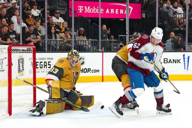 Nov 4, 2023; Las Vegas, Nevada, USA; Vegas Golden Knights goaltender Adin Hill (33) makes a save as Colorado Avalanche left wing Artturi Lehkonen (62) looks for a deflection during the first period at T-Mobile Arena.