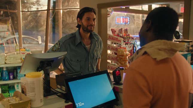 Tim chats to the cashier in a gas station.