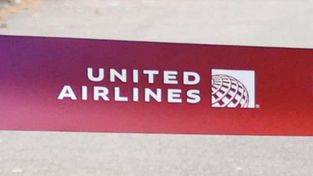 A close-up of the United Airlines logo on the finish line tape for a half-marathon