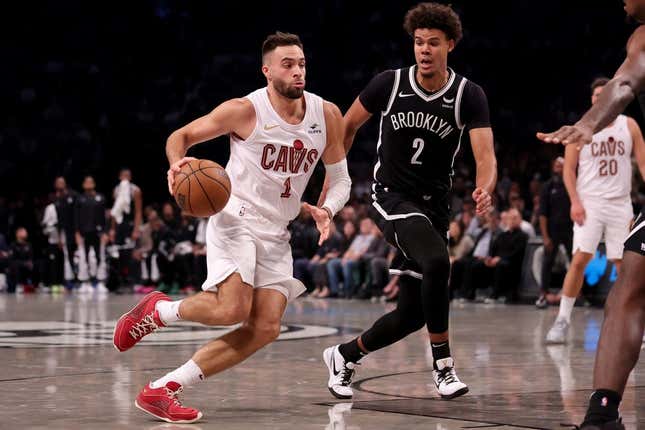 Oct 25, 2023; Brooklyn, New York, USA; Cleveland Cavaliers guard Max Strus (1) drives to the basket against Brooklyn Nets forward Cameron Johnson (2) during the second quarter at Barclays Center.