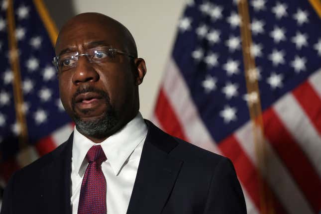 U.S. Sen. Raphael Warnock (D-GA)) speaks to members of the press after a Senate Democratic Caucus meeting on January 18, 2022, in Washington, DC.