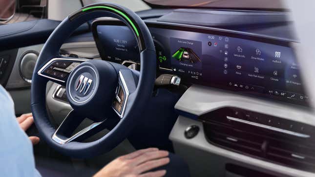 A photo of the Buick Enclave with Super Cruise active, showing a green light bar at the top of the steering wheel