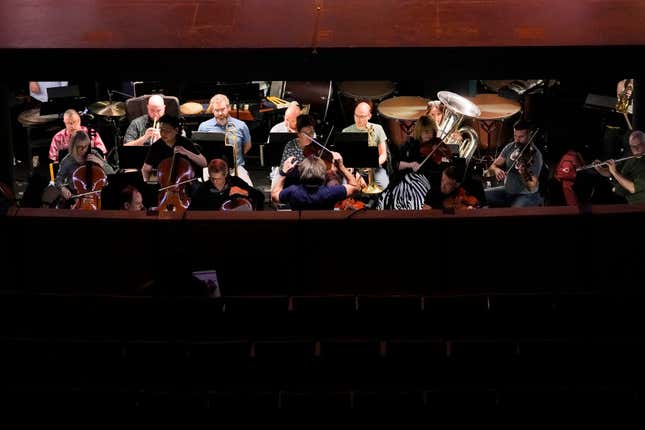 Ballet Arizona musicians rehearse for the &quot;Nutcracker&quot;, Thursday, Dec. 7, 2023, in Phoenix prior to an upcoming performance. A pit full of musicians is part of the tradition of the holiday staple for Ballet Arizona and many other productions around the world. Shows use recordings as they weather costs or crises like recessions. But fans, musicians and the unions that represent them say the live music brings an unseen signature to each show. (AP Photo/Matt York)