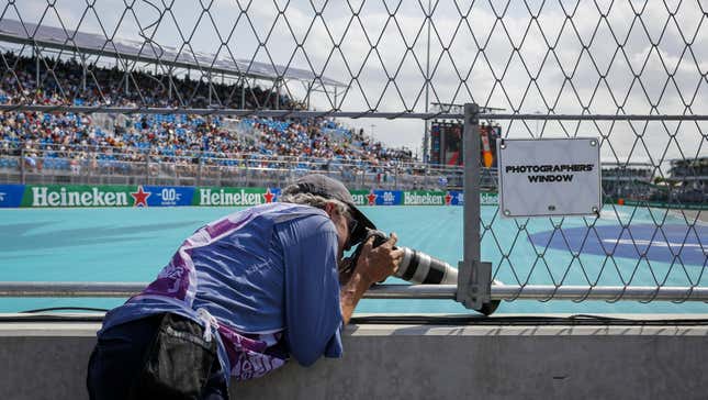 A photographer takes photos of drivers during the qualifying session ahead of the F1 Grand Prix of Miami at the Miami International Autodrome on May 6, 2023 in Miami Gardens, Florida, United States.
