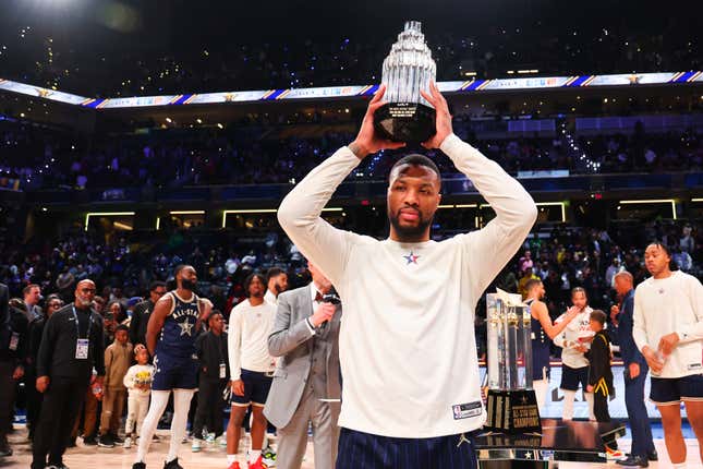 INDIANAPOLIS, INDIANA - FEBRUARY 18: Damian Lillard #0 of the Milwaukee Bucks lifts the Kobe Bryant All-Star MVP trophy during the 2024 NBA All-Star Game at Gainbridge Fieldhouse on February 18, 2024 in Indianapolis, Indiana. NOTE TO USER: User expressly acknowledges and agrees that, by downloading and or using this photograph, User is consenting to the terms and conditions of the Getty Images License Agreement. (Photo by Stacy Revere/Getty Images)