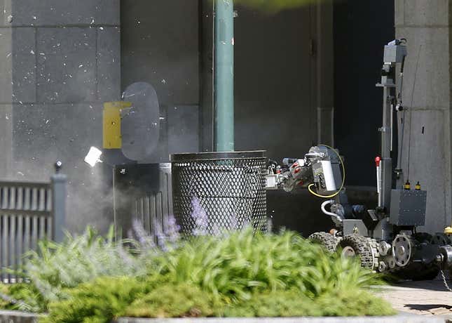 Police robot blowing up suspicious package