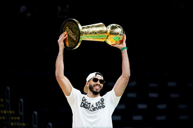 ayson Tatum #0 of the Boston Celtics hoists the Larry O’Brien trophy as he is introduced during the Boston Celtics Victory Event following their 2024 NBA Finals