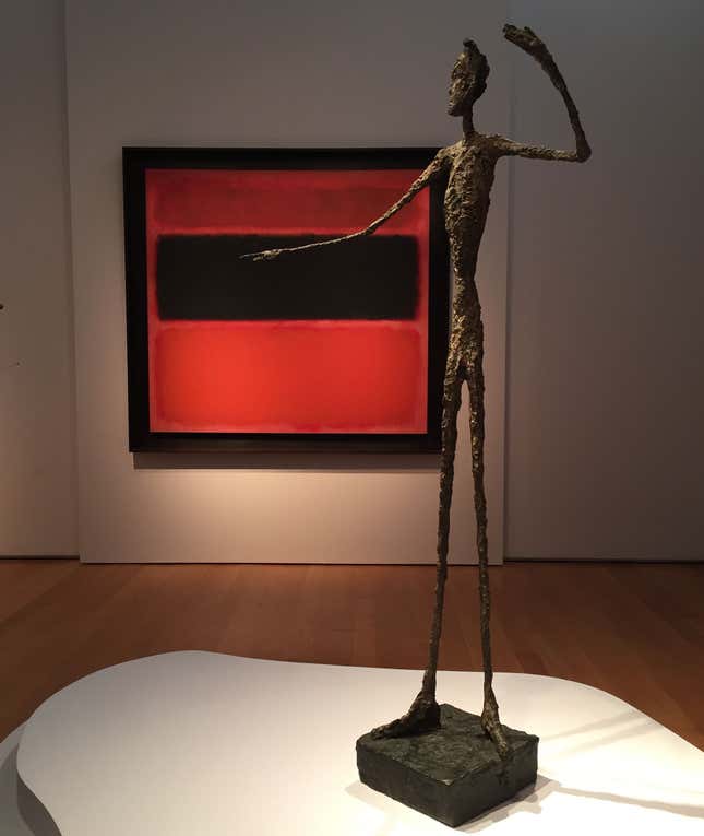Alberto Giacometti's "L'homme au doigt" with Mark Rothko's "No. 36 (Black Stripe)" in the background