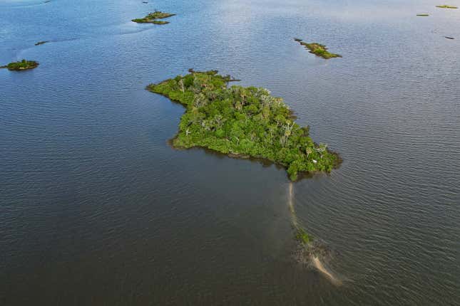 Sweetheart Island, center, off the coast of Yankeetown, Fla., is seen on Aug. 5, 2023. While Patrick Parker Walsh&#39;s private island ranks among the most unusual purchases by pandemic fraudsters, his crime was not unique. He is one of thousands of thieves who perpetrated the greatest grift in U.S. history. They potentially plundered more than $280 billion in federal COVID-19 aid; another $123 billion was wasted or misspent. (AP Photo/Julio Aguilar)