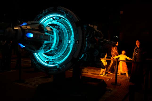 A child reacts to a depiction of a space craft at an exhibition about &quot;The Three-Body Problem&quot; in Chengdu, Sichuan province on Friday, Oct. 20, 2023. The series that began with &quot;The Three-Body Problem,&quot; written by former engineer Liu Cixin, helped Chinese science fiction break through internationally, winning awards and making it onto the reading lists of the likes of former U.S. President Barack Obama and Mark Zuckerberg. (AP Photo/Ng Han Guan)