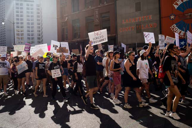 Abortion rights demonstrators march through the streets to protest the  Supreme Court’s decision in the Dobbs v Jackson Women’s Health case on  June 24, 2022 in Detroit, Michigan