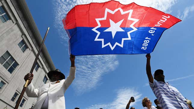 A Juneteenth flag is raised during the Celebration of Juneteenth at the African American Civil War Memorial event on Monday June 20, 2022 in Washington, DC.