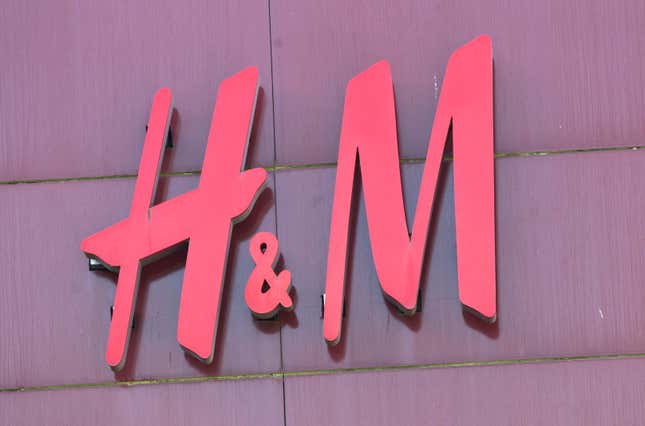 File - The logo of Swedish clothing-retail company Hennes &amp; Mauritz (H&amp;M) is pictured in Velizy, outside Paris, France, Wednesday, Sept. 20, 2017. A pioneering bill to curb the rampant pace of fast fashion won unanimous approval in the French Parliament, making France one of the first countries in the world to target the influx of low-cost, mass-produced garments. (AP Photo/Michel Euler)