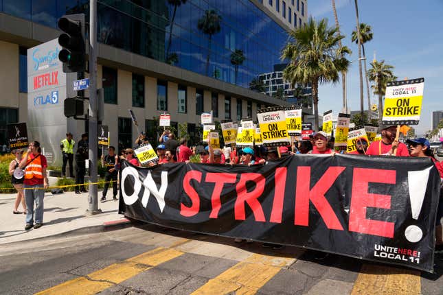 FILE - Striking Hotel workers from Unite Here Local 11 join the picketing actors of SAG-AFTRA, and writers of the WGA, outside Netflix studios, July 21, 2023, in Los Angeles. On Saturday, Sept. 30, California Democratic Gov. Gavin Newsom vetoed a bill that would have made some striking workers eligible for unemployment benefits. (AP Photo/Chris Pizzello, File)