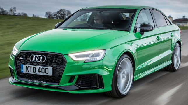 A bright green Audi RS3 from the front 3/4 angle on a track