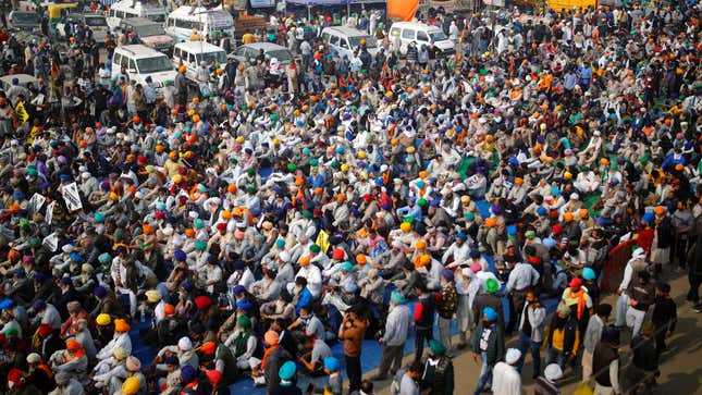 Farmers listen to a speaker during a protest against the newly passed farm bills at Singhu border near Delhi, India, December 5, 2020.
