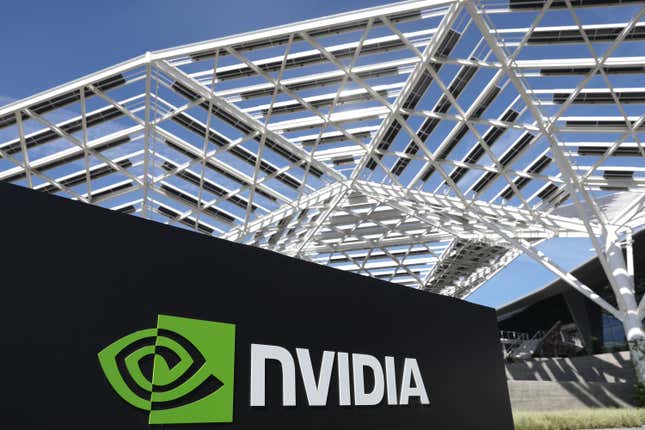 Nvidia sign is posted outside the Nvidia headquarters under a white, web-like structure