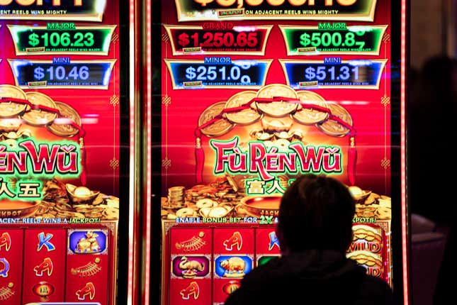 A patron of The Rivers Casino in Portsmouth, Va., plays on one of the several varieties of games during the casino&#39;s grand opening, Jan. 23, 2023. With casinos popping up on Virginia&#39;s southern border, some lawmakers now want to explore whether wealthy northern Virginia should get in on the action. (Billy Schuerman/The Virginian-Pilot via AP)