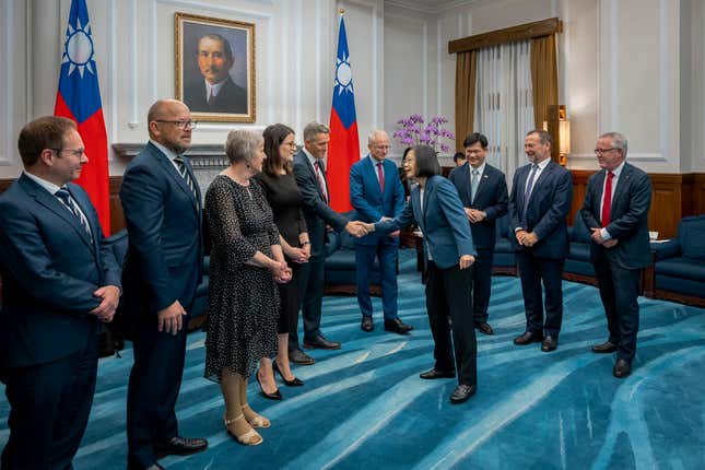 FILE - In this photo released by the Taiwan Presidential Office, visiting Australian lawmakers is greeted by Taiwan&#39;s President Tsai Ing-wen at the Presidential Office in Taipei, Taiwan on Tuesday, Sept. 26, 2023. The Chinese government on Wednesday, Sept. 27, accused Taiwan&#39;s ruling party of seeking independence, a day after the self-governing island&#39;s president lobbied for Australia&#39;s support in joining a regional trade pact. (Taiwan Presidential Office via AP, File)