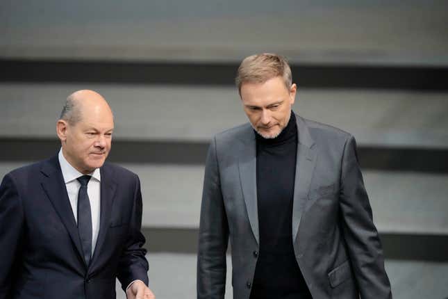 FILE - German Chancellor Olaf Scholz, left, and German Finance Minister Christian Lindner arrive for the debate about the budget 2023 at the parliament Bundestag in Berlin, Germany, on Nov. 22, 2022. Germany&#39;s economy shrank in recent months and business confidence is still in the dumps, according to figures released Friday, Nov. 24, 2023 while the government is struggling to overcome a budget crisis that threatens to exacerbate problems in what was already the world’s worst-performing major developed economy. (AP Photo/Markus Schreiber, File)