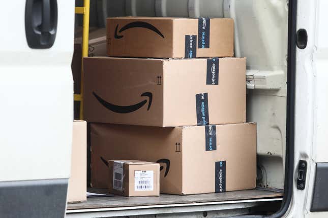 Amazon boxes inside a delivery truck. 