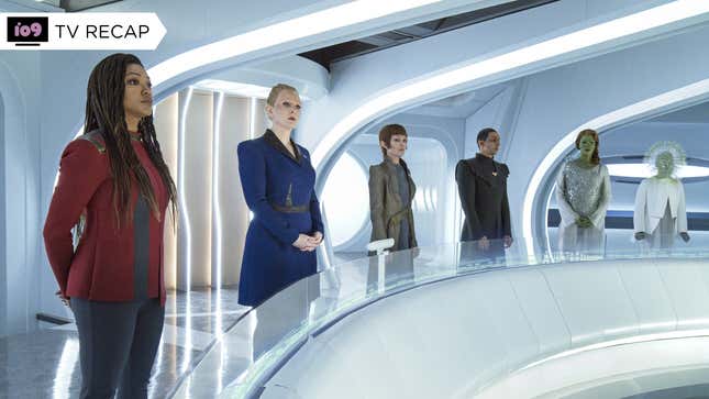 Michael Burnham, President Rillak, and several alien diplomats stand attending a conference at Federation HQ.