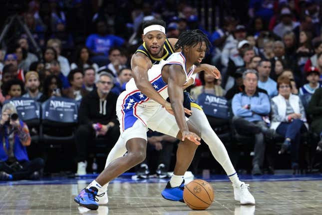 Nov 12, 2023; Philadelphia, Pennsylvania, USA; Indiana Pacers forward Bruce Brown (11) tries to steal the ball away from Philadelphia 76ers guard Tyrese Maxey (0) during the first quarter at Wells Fargo Center.