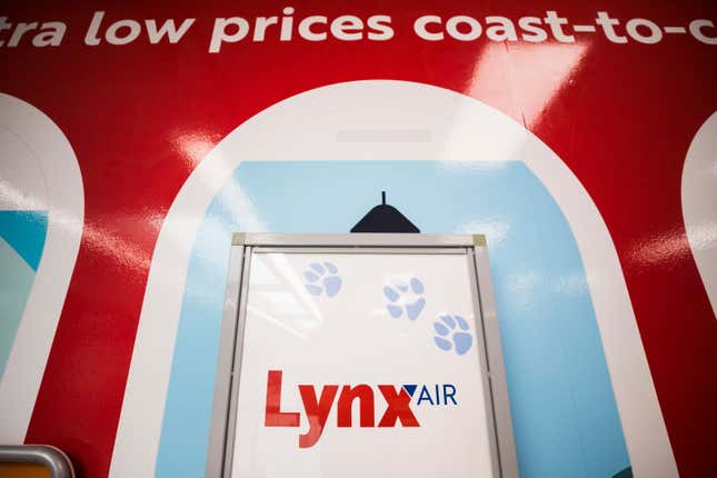 Lynx Air signage is displayed at the John C. Munro Hamilton International Airport in Hamilton, Ontario, Friday, Feb. 23, 2024. Officials with the Calgary-based company announced that it is ceasing operations after filing for creditor protection. (Nick Iwanyshyn/The Canadian Press via AP)